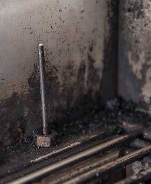 dirty thermometer probe inside a grill dirty thermometer probe inside a grill