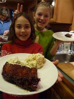 kids holding up a plate of barbecue kids holding up a plate of barbecue