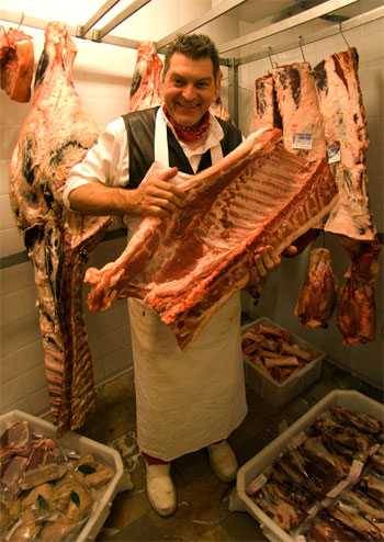 Dario Cecchini showing off a rib section for porchetta Dario Cecchini showing off a rib section for porchetta