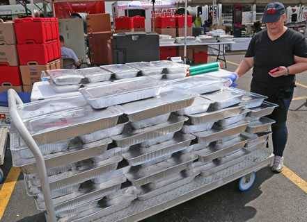 Trays of food from Operation BBQ Relief shipping to distribution centers Trays of food from Operation BBQ Relief shipping to distribution centers