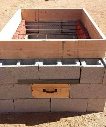 concrete block hog pit with rebar and scalloped garden edging concrete block hog pit with rebar and scalloped garden edging