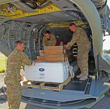 Military delivering meals from Operation BBQ Relief Military delivering meals from Operation BBQ Relief