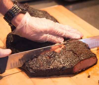 Slicing brisket and removing the thin part of the flat.