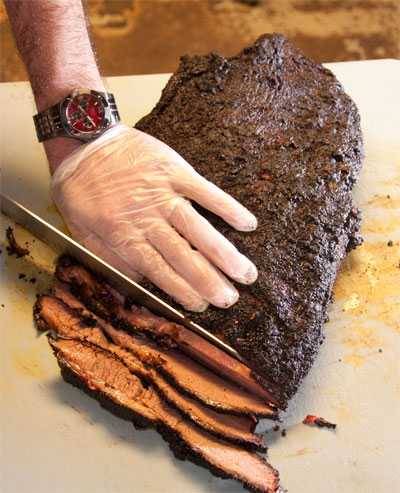 Slicing a brisket in the thick center part of the flat.