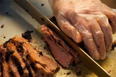 Barry Sorkin slicing a smoked brisket.