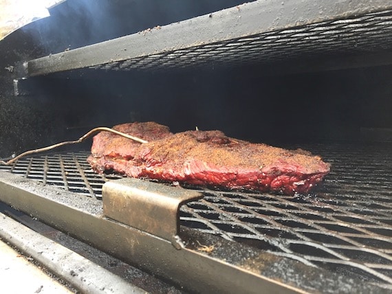 barbecue brisket on smoker.