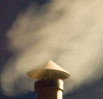 smoke coming out of a barbecue chimney smoke coming out of a barbecue chimney
