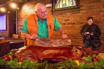 Mike Mills serving whole hog