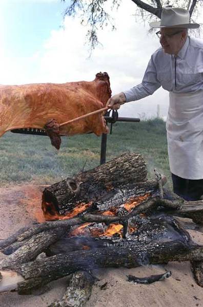 Walter Jetton, LBJ's cook, barbecues a whole steer